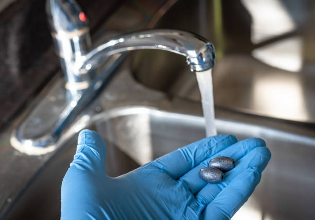 Tap water and lead metal contamination stock photo