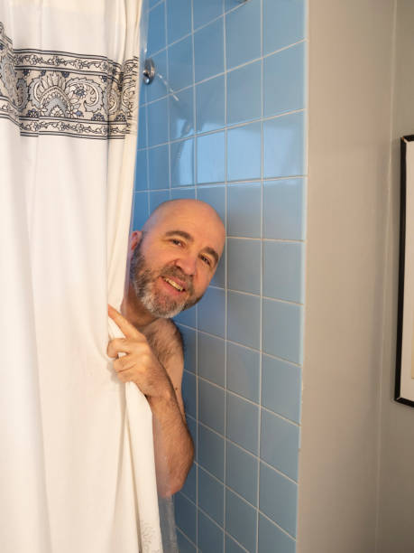 Man in the shower stock photo