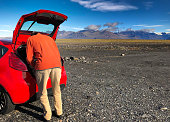 Iceland Road Trip: Man, Open Car Trunk, Mountains
