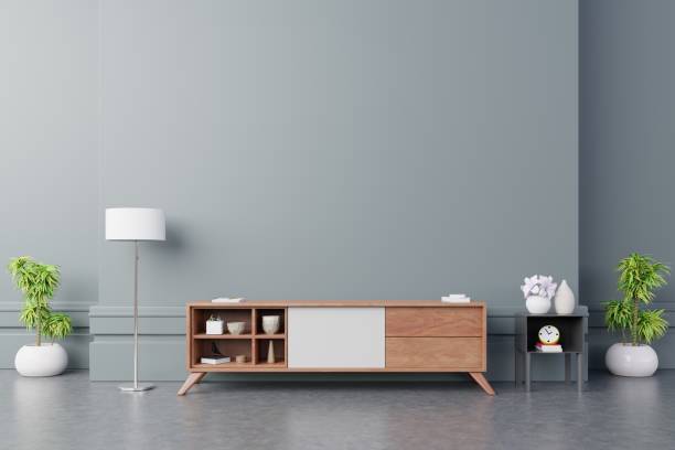 istock Tv cabinet in modern empty room on back dark wall background. 1188303384