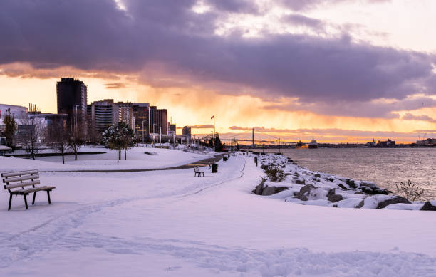 The Windsor, Ontario skyline during Winter.  The Ambassador Bridge can be seen in the far background.  The bridge connects Windsor with Detroit, Michigan.