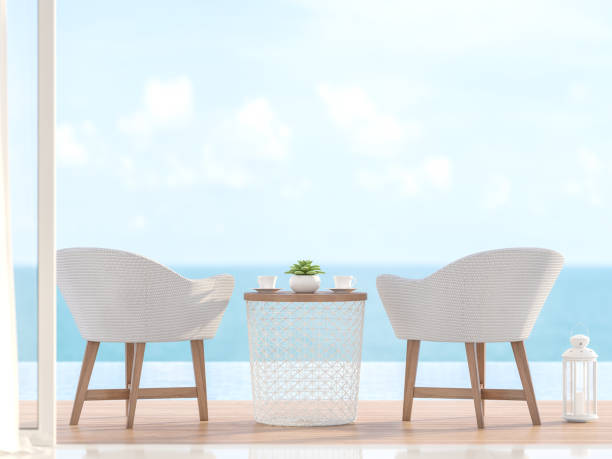 istock Closeup image of 2 white chairs with blurry sea view 3d render 1188306000
