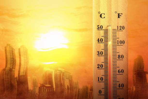 istock Thermometer with high temperature on the city with glowing sun background 1188306964