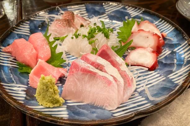 istock Raw fish slice Japanese food on the table 1188308922