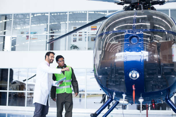 istock Helicopter technicians are in the hangar checking important information from a tablet 1188324585