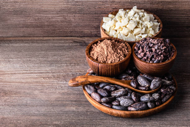 istock Cocoa products in wooden bowls spoon on old rustic background 1188324617