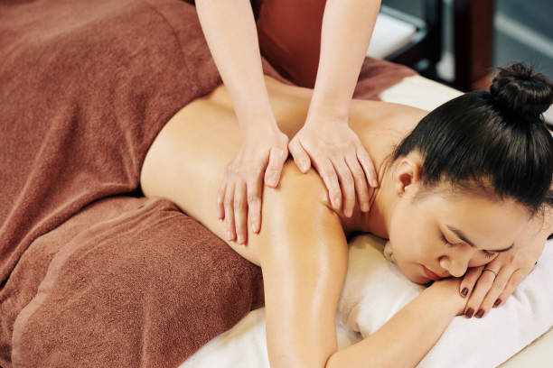 istock Massaging back of female client 1188324742