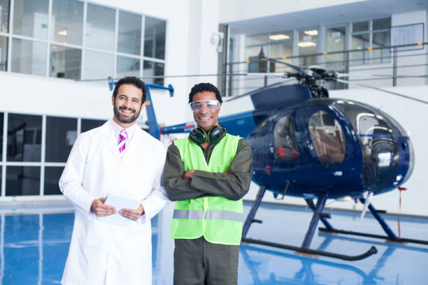 istock Helicopter technicians are in the hangar checking important information from a tablet 1188325368