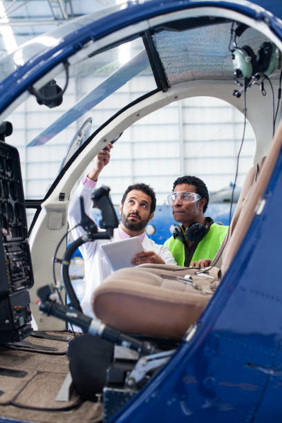 Engineer gives the technician instructions on the work to be done to the helicopter