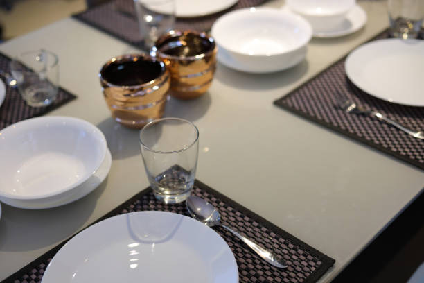 istock white dish ware sets arrange on dinner table inside eating room of modern home interior 1188325637