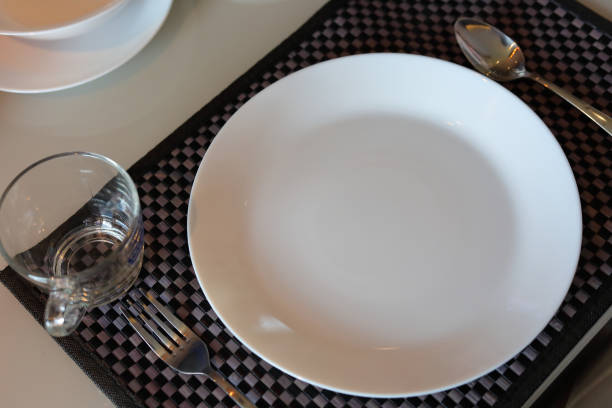 istock white dish ware sets arrange on dinner table inside eating room of modern home interior 1188325670