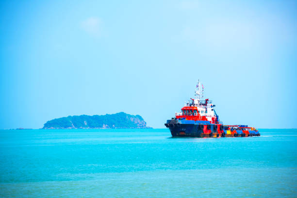 Cargo ship in the sea in poor weather days, near travel cats island in Songkhla Thailand
