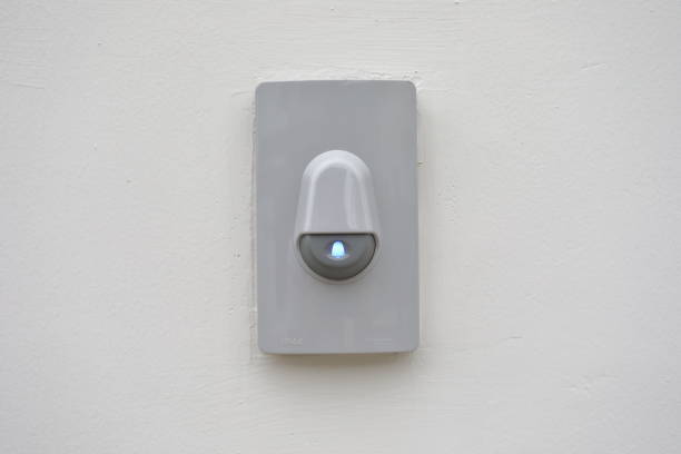 istock doorbell on white wall of front gate 1188325686