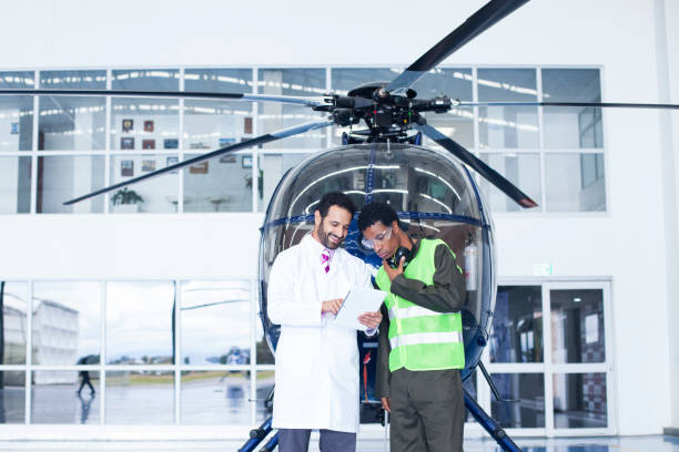 istock Helicopter technicians are in the hangar checking important information from a tablet 1188325836