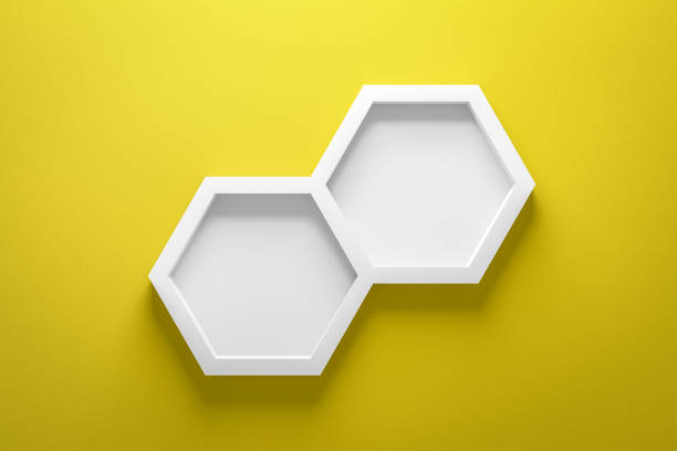 Front view of empty shelf and hexagon frame on vivid yellow wall background with modern minimal concept. Display of room shelves for showing. Realistic 3D render. Front view of empty shelf and hexagon frame on vivid yellow wall background with modern minimal concept. Display of room shelves for showing. Realistic 3D render. hexagon photos stock pictures, royalty-free photos & images