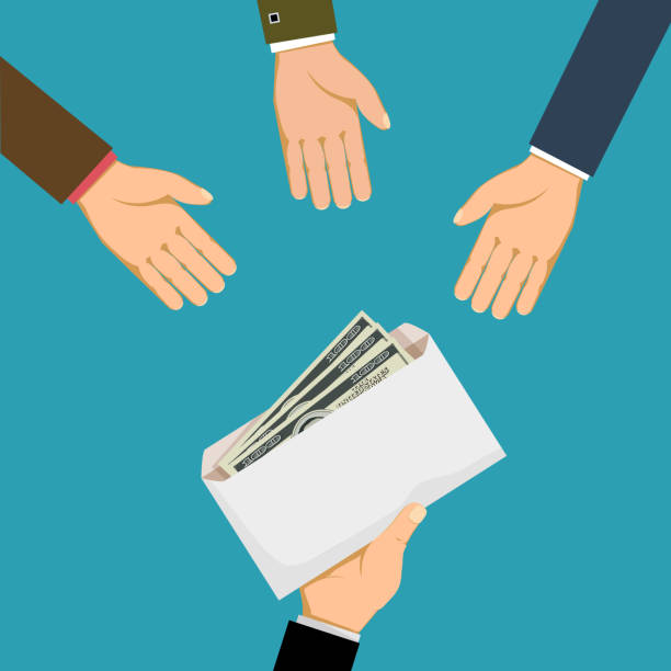 istock Man gives an envelope with money or bribe to businessmen 1188331189