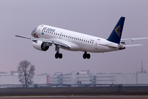 Borispol, Ukraine - November, 14, 2019: P4-KHA Air Astana Embraer E190-E2 aircraft in the snow leopard livery departing from the Borispol International Airport