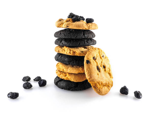 cookie assortiti disposti in una pila. uvetta sparsa in giro - oat oatmeal isolated stack foto e immagini stock