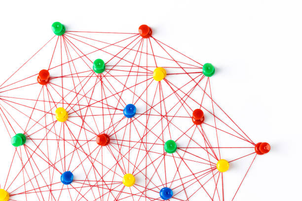 istock Network connection made from push pins and thread on blue background, close-up. 1188337990