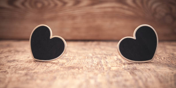 istock Wooden hearts on wooden table. 1188340461