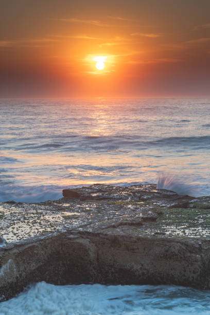 istock Rocky Smoke Haze Sunrise Seascape 1188341416
