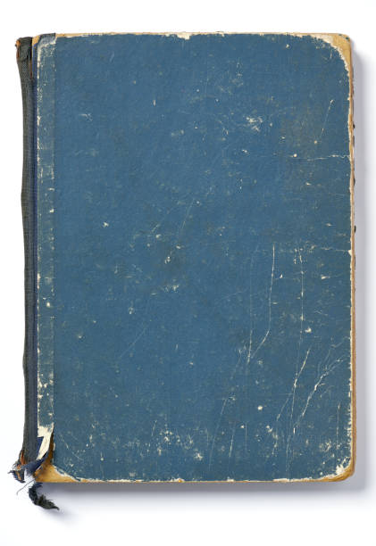 High resolution photograph of an very old blue paperback book Blue paperback book cover, strongly used, and white background. old book stock pictures, royalty-free photos & images