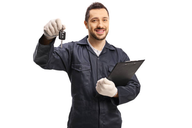 istock Auto mechanic with a car key and a clibboard 1188342635