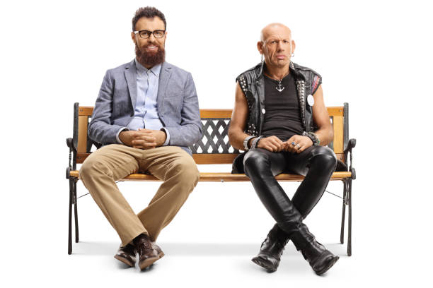istock Smiling bearded man and a grumpy punker sitting on a bench 1188342953