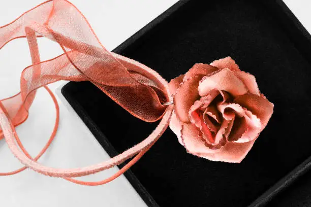 Beige textile tea rose pendant in black jewel box