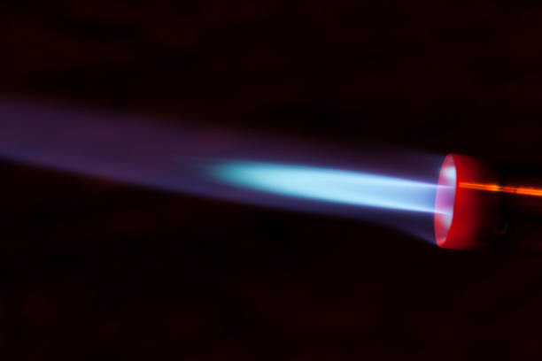 The blue bright light of a gas burner closeup.