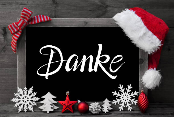 Chalkboard, Christmas Decoration, Ball, Tree, Danke Means Thank You Chalkboard With German Calligraphy Danke Means Thank You. Christmas Decoration Like Tree, Ball And Santa Hat. Gray Wooden Background german language photos stock pictures, royalty-free photos & images