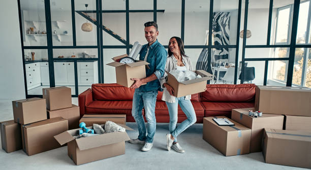 istock Couple moving in new home. 1188349364