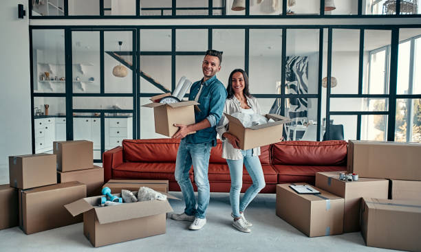 istock Couple moving in new home. 1188349368