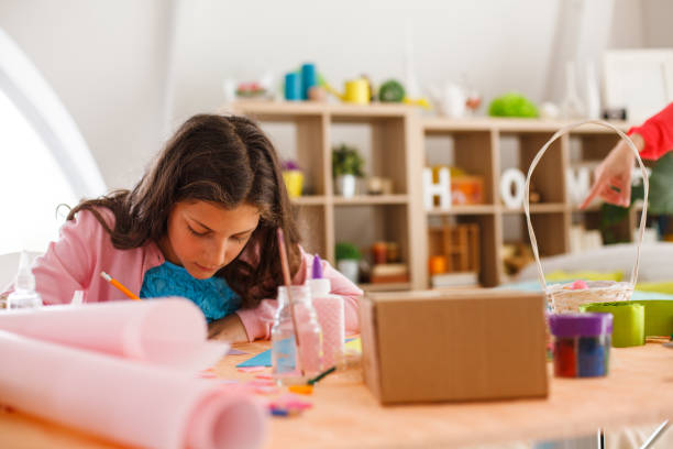 istock Girl doing art work at home 1188352034