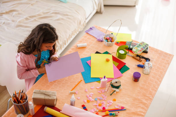 istock Girl making Easter decoration at home 1188352038