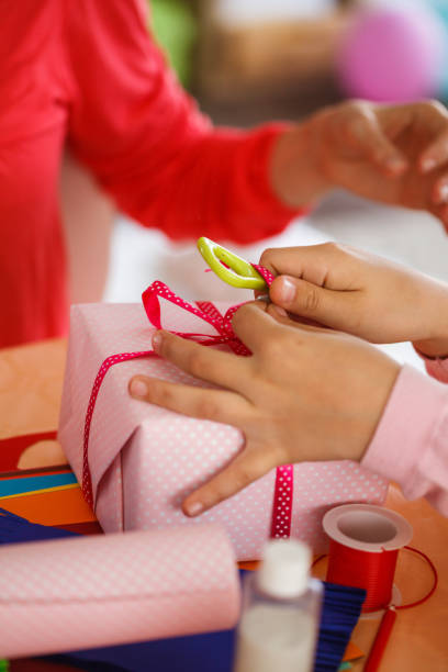 istock Girl curl ribbon on gift box 1188353925