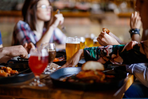 istock Having dinner and craft beer in a pub with friends 1188354434