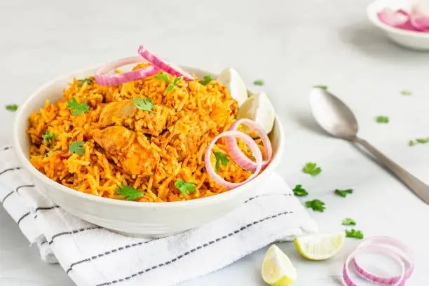 Indian Chicken Pulao, Chicken Fried Rice with Lemon and Onion, Indian Food Photography.