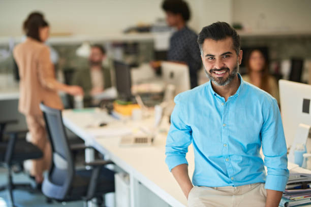 istock Team leader looking at the camera in his office. 1188357847