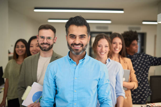 istock Business team group portrait looking at the camera. 1188357856
