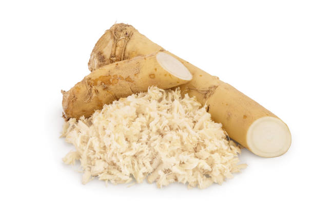 istock Horseradish root with slices grated pile isolated on white background 1188360690
