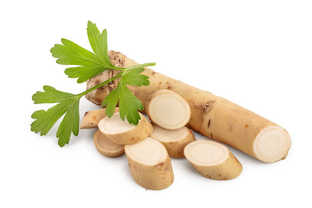 istock Horseradish root with slices and parsley isolated on white background 1188360706