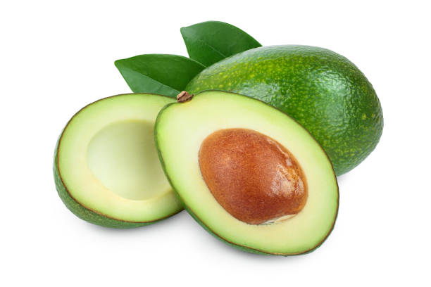 アボカドと半分の葉が白い背景のクローズアップに隔離 - avocado brown close up dieting ストックフォトと画像