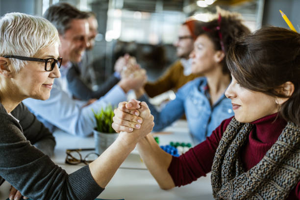 istock Arm wrestling among business and creative team! 1188362091