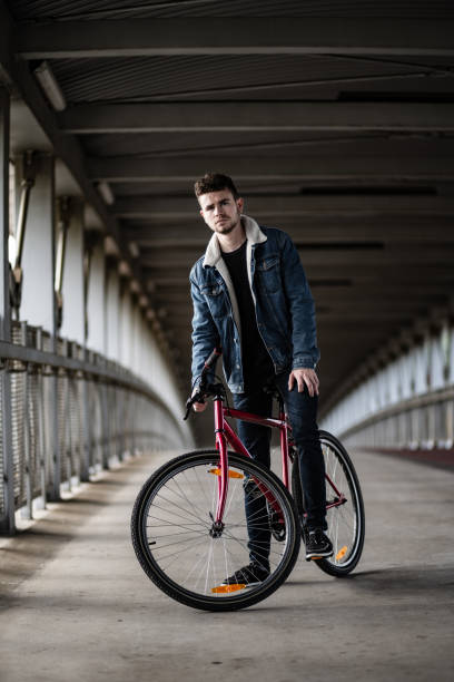 istock Young man biking in city 1188363673