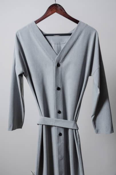 istock dress on hangers on garment rack 1188365905