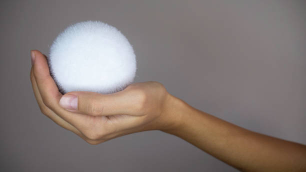 istock A woman's hand holding a snowball. 1188366041