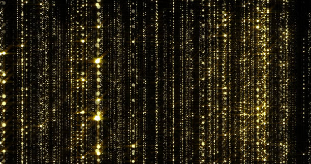 istock Golden glitter threads curtain, flowing light particles with bokeh sparks. Gold glitter falling flow background with magic glowing shimmer glare 1188366392