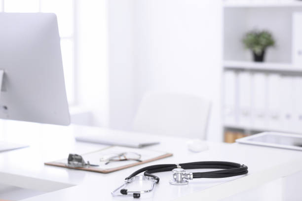 istock Stethoscope, prescription medical form lying on a table with pc computer. Medicine or pharmacy concept. Medical tools at doctor working table 1188366685