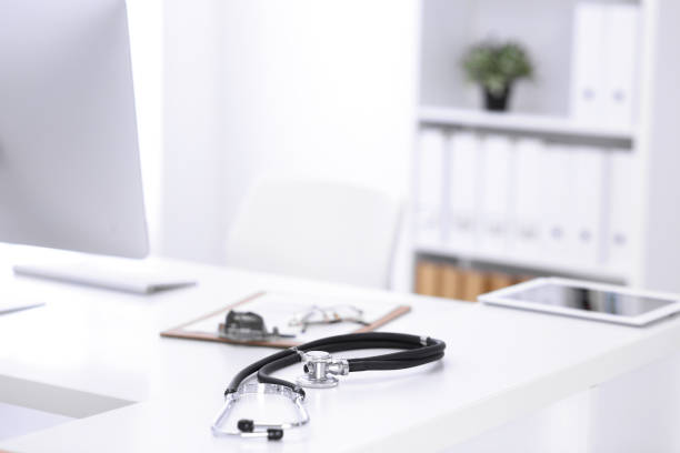 istock Stethoscope, prescription medical form lying on a table with pc computer. Medicine or pharmacy concept. Medical tools at doctor working table 1188366687